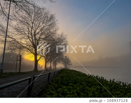 Sunrise over the river in the early morning with fog on the banks Sunrise over the river in the early morning with fog on the banks 108937128