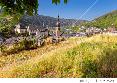 Scenic view of the old fairytale German town of Cochem and the valley on a sunny day. Germany. 108939324