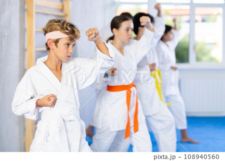 Preteen children during karate training. Martial arts. Sport, active lifestyle concept 108940560
