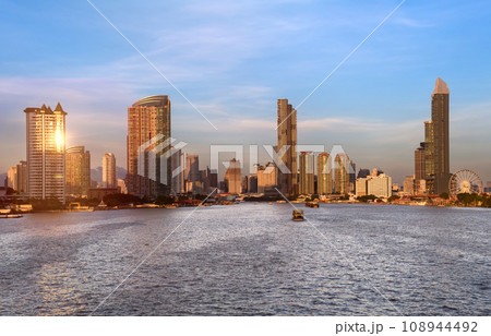 View of the buildings with a river in the foreground of the city of Bangkok 108944492
