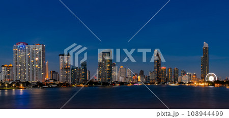 View of the buildings with a river in the foreground of the city of Bangkok 108944499