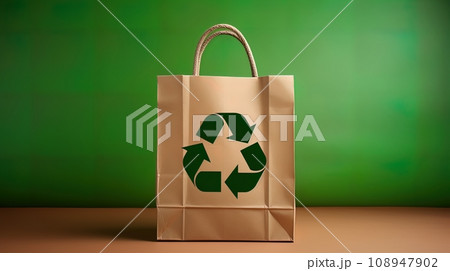 Paper bag with recycling symbol on green background. recyclable packaging concept 108947902