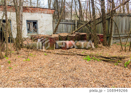Old rusty barrels in the ghost town Pripyat in Chernobyl Exclusion Zone, Ukraine Old rusty barrels in the ghost town Pripyat in Chernobyl Exclusion Zone, Ukraine 108949266