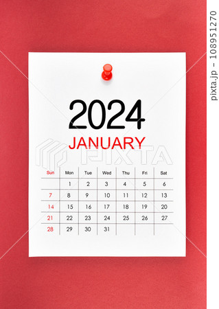 A January 2024 calendar page with push pin on red background. A January 2024 calendar page with push pin on red background. 108951270