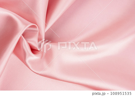 Pink fabric texture as a background. Pink fabric texture as a background. 108951535