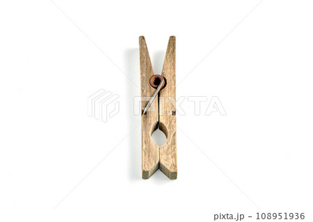 Old weathered wooden clothes peg isolated on white background Old weathered wooden clothes peg isolated on white background 108951936