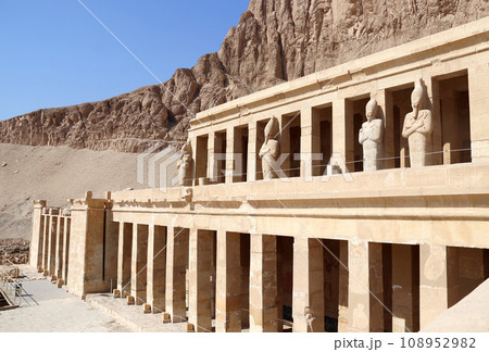 Deir el-Bahari (Deir el-Bahri) the Mortuary Temple of Hatshepsut  in Valley of the Kings, Luxor, Egypt. Statues of Queen Hatshepsut, facade of the Hatshepsut temple in Western Thebes 108952982