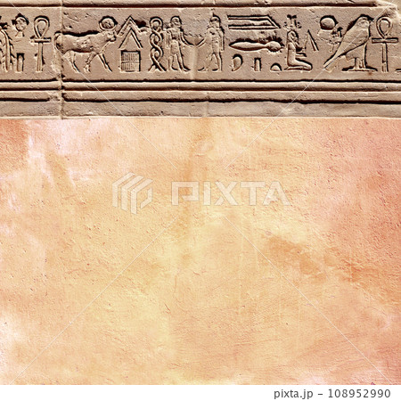 Vertical background with ancient Egyptian hieroglyphs on stone wall, Egypt, Africa. Backdrop with sandstone carving with hieroglyph. Mock up template. Copy space for text 108952990