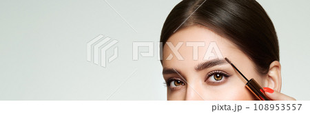 Beauty woman applying black mascara on eyelashes Beauty woman applying black mascara on eyelashes 108953557