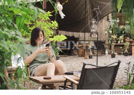 people activity with solo asian woman happy and relax during outdoor camping 108955148