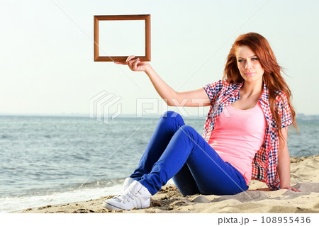 Woman Holding Frame travel concept 108955436