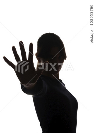 Young beautiful girl strongly against offers, denial, stop - silhouette 108955766
