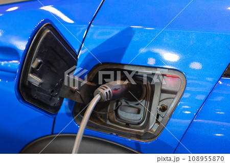 An Electric Blue Car Charging Up for the Future 108955870
