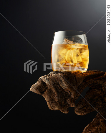 Whiskey with ice in misted glass. 108958445