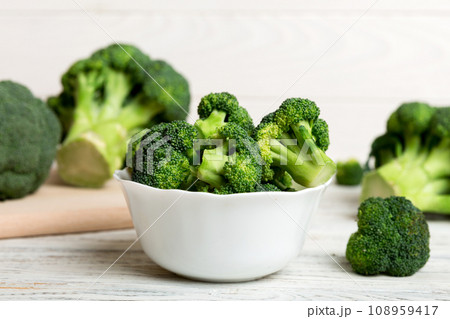 broccoli of fresh green broccoli in bowl over coloredbackground. , close up. Fresh vegetable broccoli of fresh green broccoli in bowl over coloredbackground. , close up. Fresh vegetable 108959417