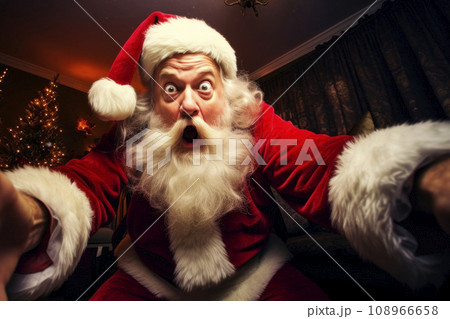 Santa, in a crazy mood, take selfie spree near the Christmas tree 108966658