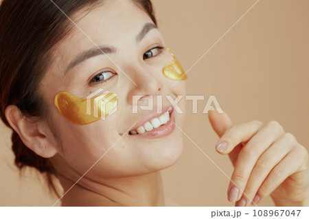 Portrait of modern asian woman with eye patches Portrait of modern asian woman with eye patches 108967047
