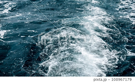 Cold ocean waves and wake from the ship motor splashing in sea 108967179
