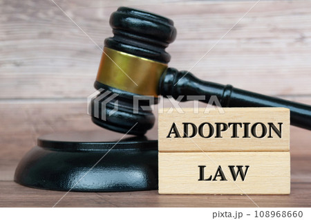 Adoption Law text engraved on wooden blocks. Adoption Law text engraved on wooden blocks. 108968660