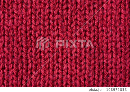 Red knitted wool texture background Red knitted wool texture background 108973058