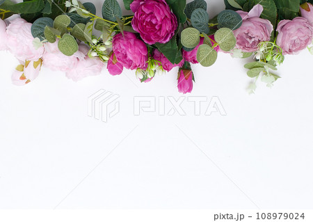 Woman with bouquet of beautiful roses on light blue background, closeup 108979024