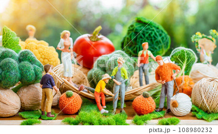 Farmers working on field in rural landscape,  miniature figure, agriculture concept,ai generated 108980232