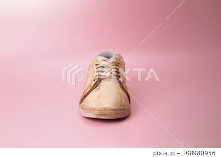 Closeup view of dirty white sneakers 108980956
