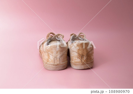 Closeup view of dirty white sneakers Closeup view of dirty white sneakers 108980970