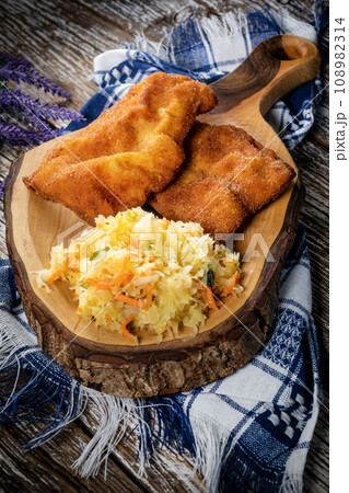 Two fried cod fillet pieces. Two fried cod fillet pieces. 108982314