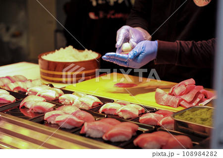 Selective focus on the hands of chef making the sushi 108984282