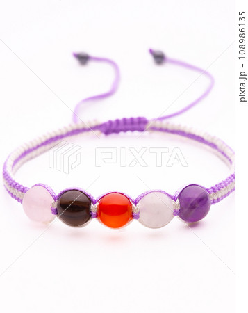Men's bracelet made of brown stone. All the details are in focus. Men's bracelet made of brown stone. All the details are in focus. 108986135