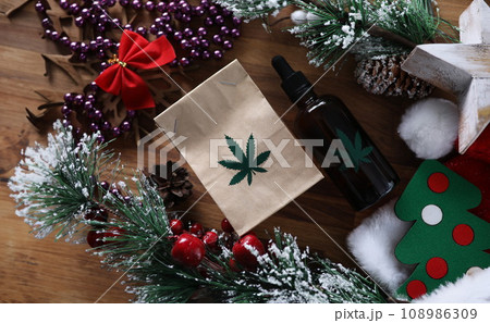 Eco paper pack with green marijuana sign with christmas Eco paper pack with green marijuana sign with christmas 108986309