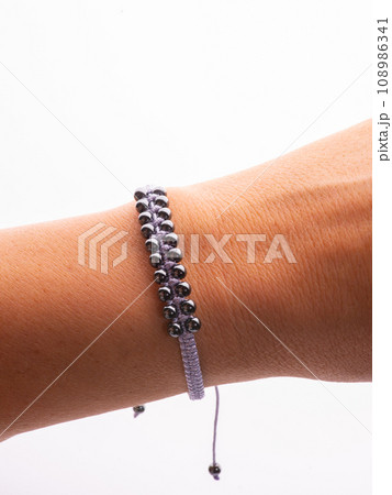 Black hematite handmade bracelet on white background 108986341