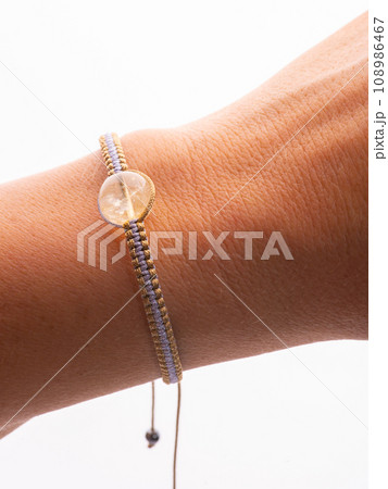 Handmade amethyst and rose quartz minelal bead bracelets with raw minerals around Handmade amethyst and rose quartz minelal bead bracelets with raw minerals around 108986467