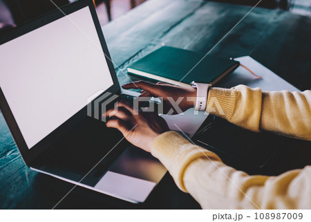 millennial woman working remotely on modern netbook 108987009