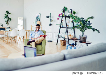Happy african american hipster guy laughing having fun during free time at home with girlfriend 108987045