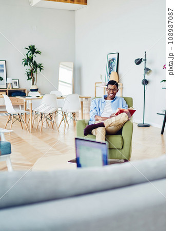 Happy african american hipster guy laughing having fun during free time at home with girlfriend 108987087