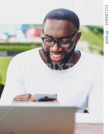 Happy male blogger in stylish eyewear checking statistics of account in social networks Happy male blogger in stylish eyewear checking statistics of account in social networks 108987153