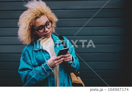 attractive female student searching media file 108987174