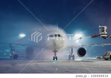 Deicing of airplane at airport. Deicing of airplane at airport. 108989918