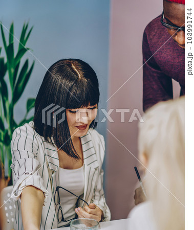 skilled team of employees share ideas communicating while making plan for common project 108991744