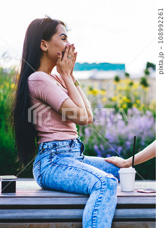Cheerful hipster girls having fun together during free time on meeting in park 108992261
