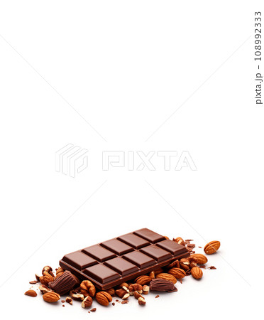 Chocolate and nuts on a white background. Chocolate pieces with almonds close-up. With copy space. 108992333