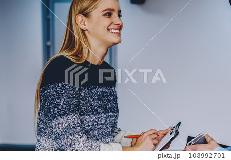 Two successful colleagues discussing collaboration for creative project in modern office Two successful colleagues discussing collaboration for creative project in modern office 108992701