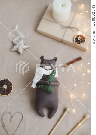 Christmas composition. Toy bear and decorations. Christmas, winter, new year concept. Flat lay, top view, copy space Christmas composition. Toy bear and decorations. Christmas, winter, new year concept. Flat lay, top view, copy space 108992948