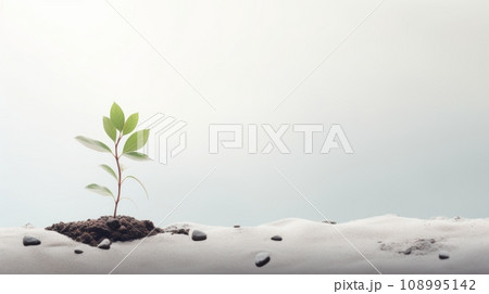 a young plant sprouting from soil against a blue sky, symbolizing new beginnings, growth, and the resilience of life. 108995142