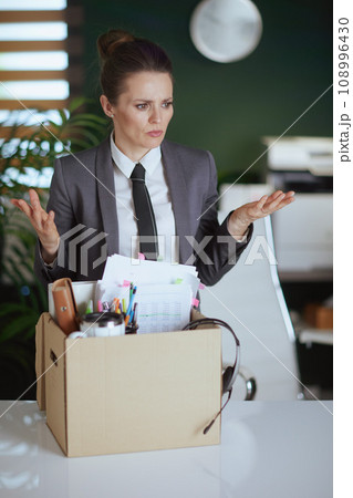 stressed modern woman worker in modern green office stressed modern woman worker in modern green office 108996430