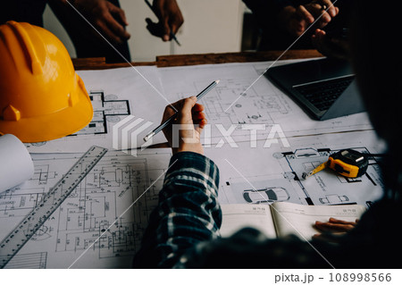 Construction and structure concept of Engineer or architect meeting for project working with partner and engineering tools on model building and blueprint in working site, contract for both companies. Construction and structure concept of Engineer or architect meeting for project working with partner and engineering tools on model building and blueprint in working site, contract for both companies. 108998566