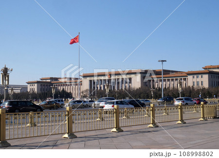 Flag of China on the mast in Tiananmen Square. It's the third largest square in the world and important site in Chinese history, in Beijing. 108998802