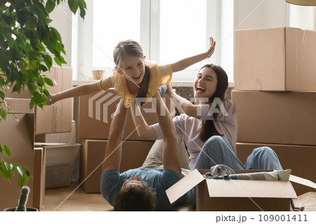 Young family with daughter celebrate moving day Young family with daughter celebrate moving day 109001411